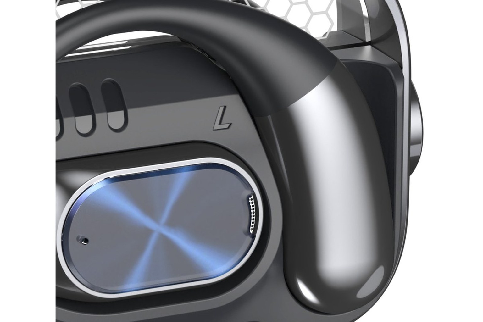 Close-up of an open-ear clip earbud showing the metal speaker grille, the flexible hook and the light guide on a dark housing, with the ear canal left unsealed